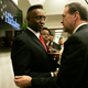 Republican presidential hopeful and former Arkansas Gov. Mike Huckabee talks to the Rev. O’Neal Dozier, pastor of the Worldwide Christian Center, during a campaign stop in Fort Lauderdale, Fla., on Jan. 25, 2008. (J. Pat Carter/AP Images)